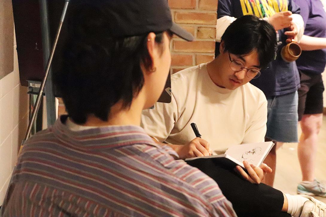 a student sketching a model