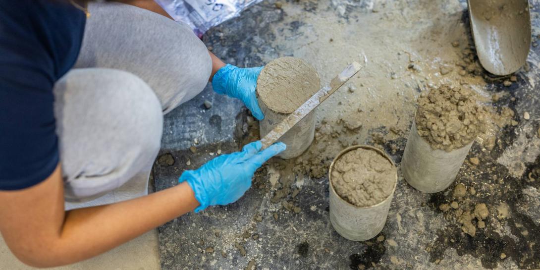 Close up of hands working with concrete