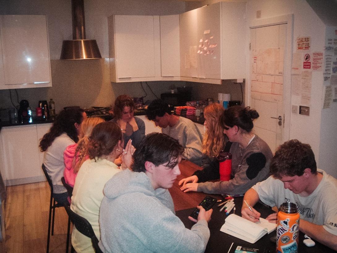 Calvin University students sitting at a table in London