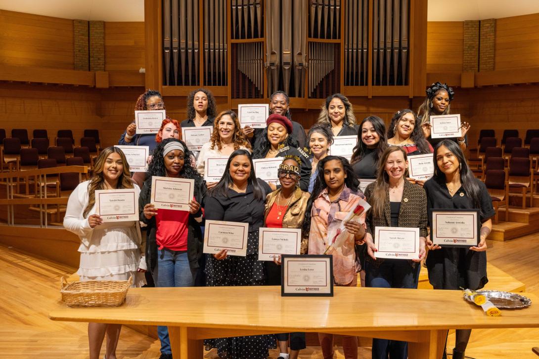 Wayfinder graduation - a group of students holding completion certificates