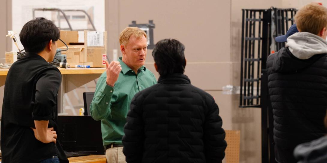 Michael VanWoerkom talking with students at Calvin