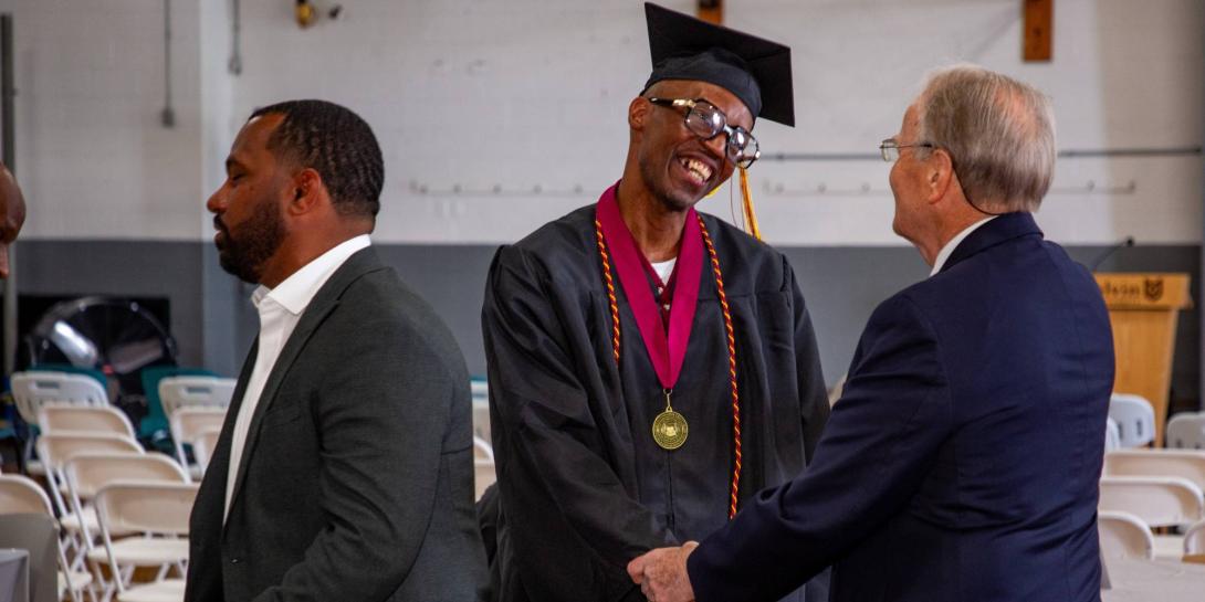 Richard E. Jackson Jr., a graduate of the 2026 Calvin Prison Initiative program, is greeted by faculty