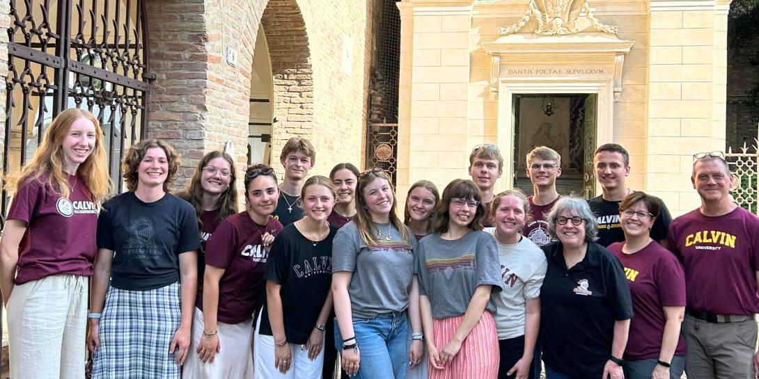 Anna Haverdink with a group of Calvin students and faculty and staff in Calvin gear in Ravenna, Italy