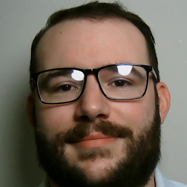 Smiling bearded man with glasses