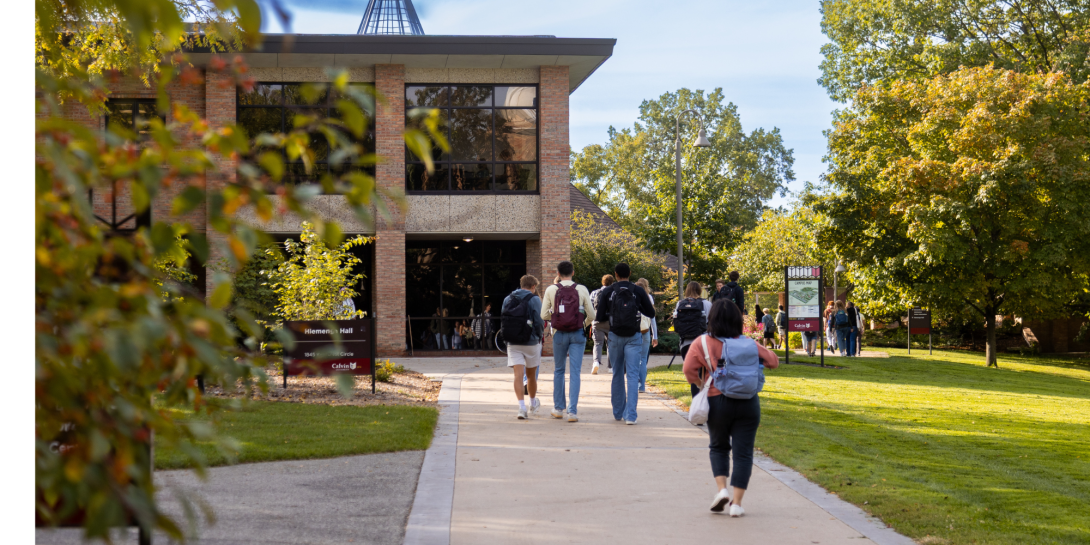 Calvin students walk on the path in Fall 2025