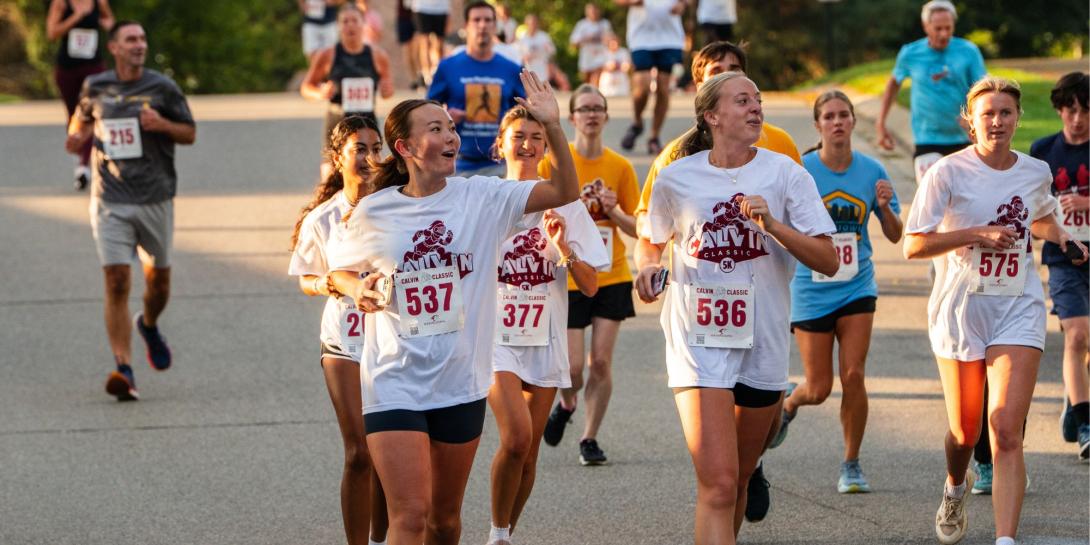People running on Calvin University's campus in Fall 2025