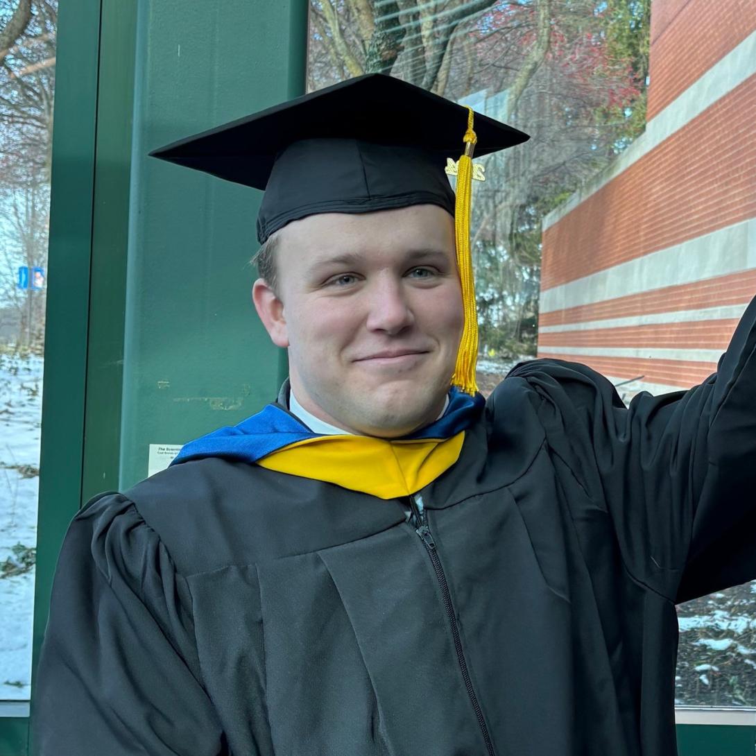 Mason Kolanowski smiling graduation photo