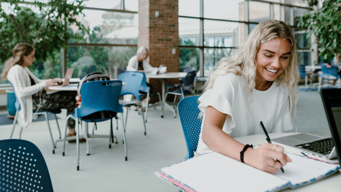 Woman writing in a notebook