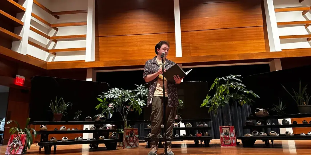 Student talking on stage