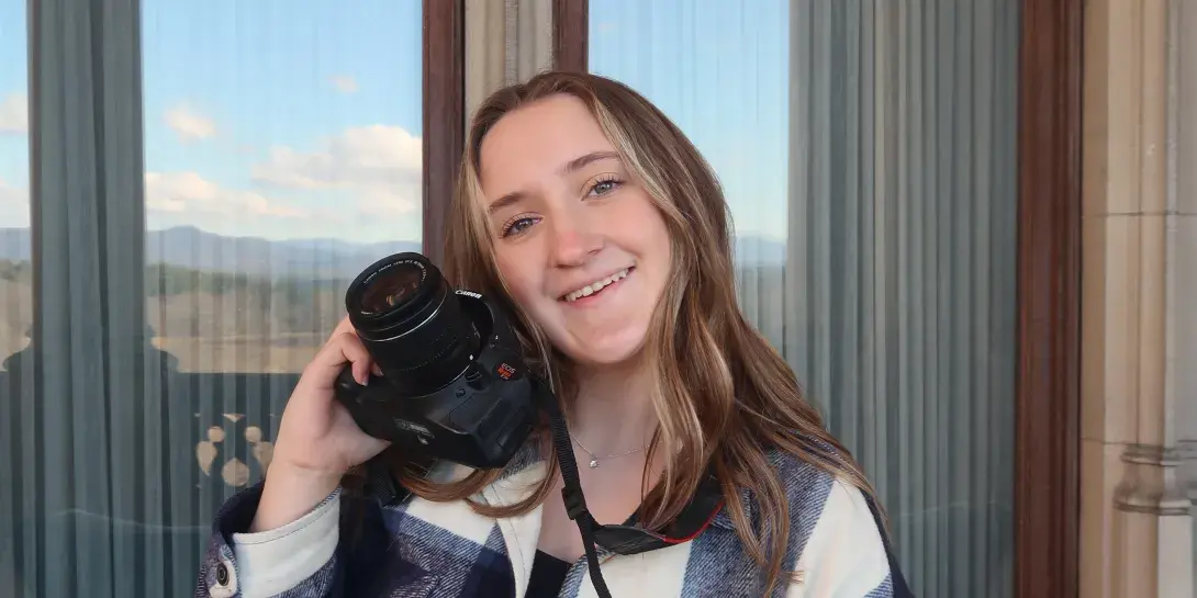Madison Coleman poses with her camera.