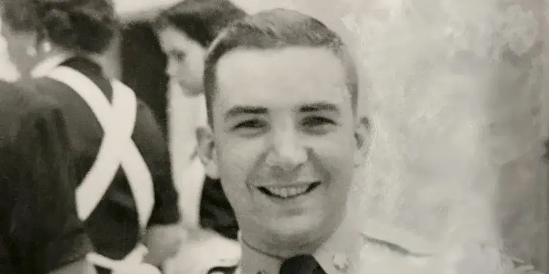 Doug Gardner, a Calvin alumnus, smiling in his military gear during the Korean War