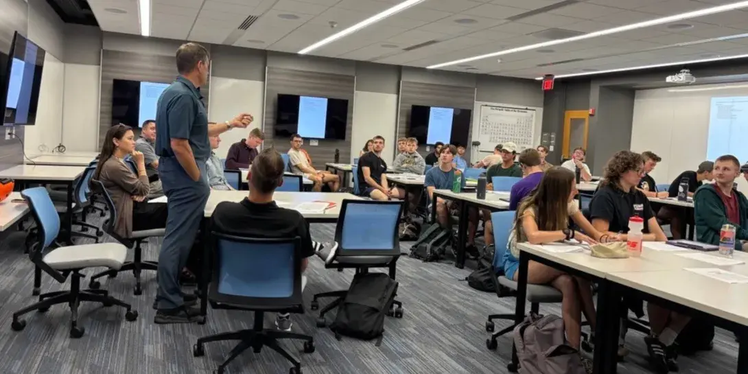 An engineering class at Calvin University is introduced to a semester project where they are tasked with recommending how to set up a green revolving fund for the city of Grand Rapids, Michigan.