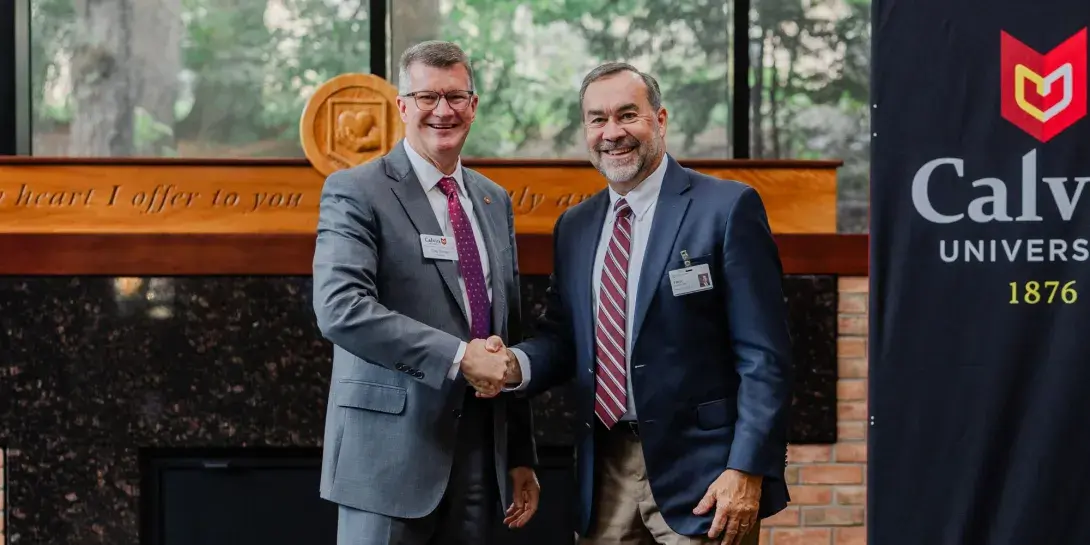 Calvin President Greg Elzinga and Trillium President Troy Vugteveen