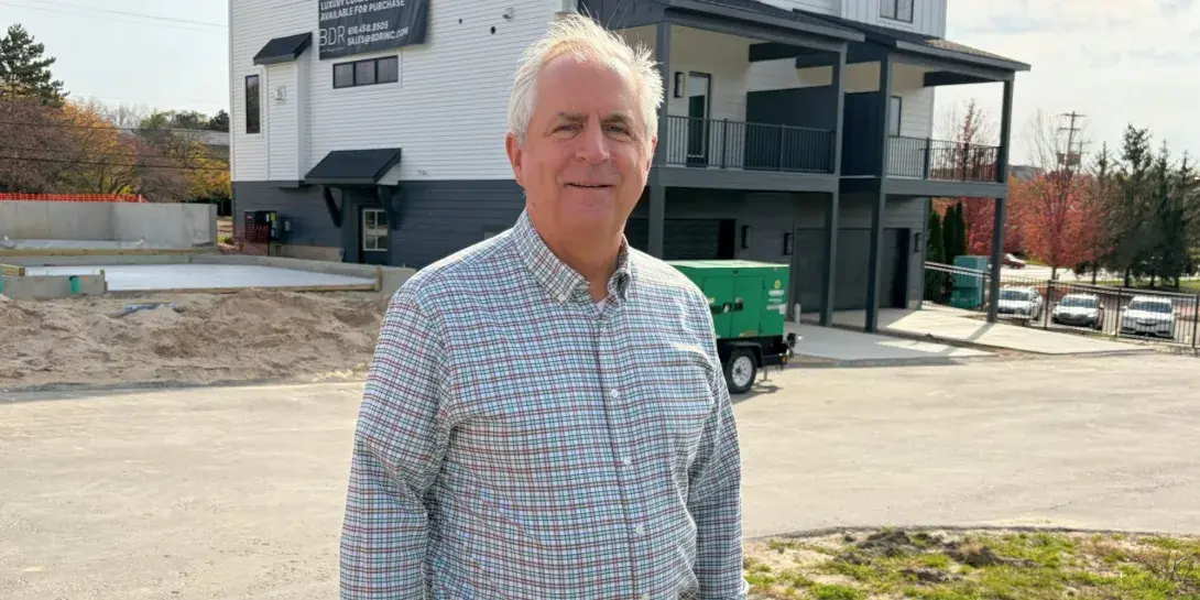 Kevin Einfeld, president of BDR Executive Custom Homes, Inc., standing in front of one of his properties.