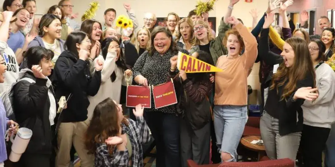 Stacia Hoeksema surrounded by students, faculty, staff, and family celebrating her.